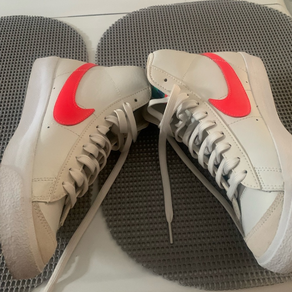 White Nike high top sneakers with color accents